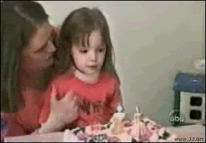boy%20blows%20out%20cake%20candle%20before%20sister.gif